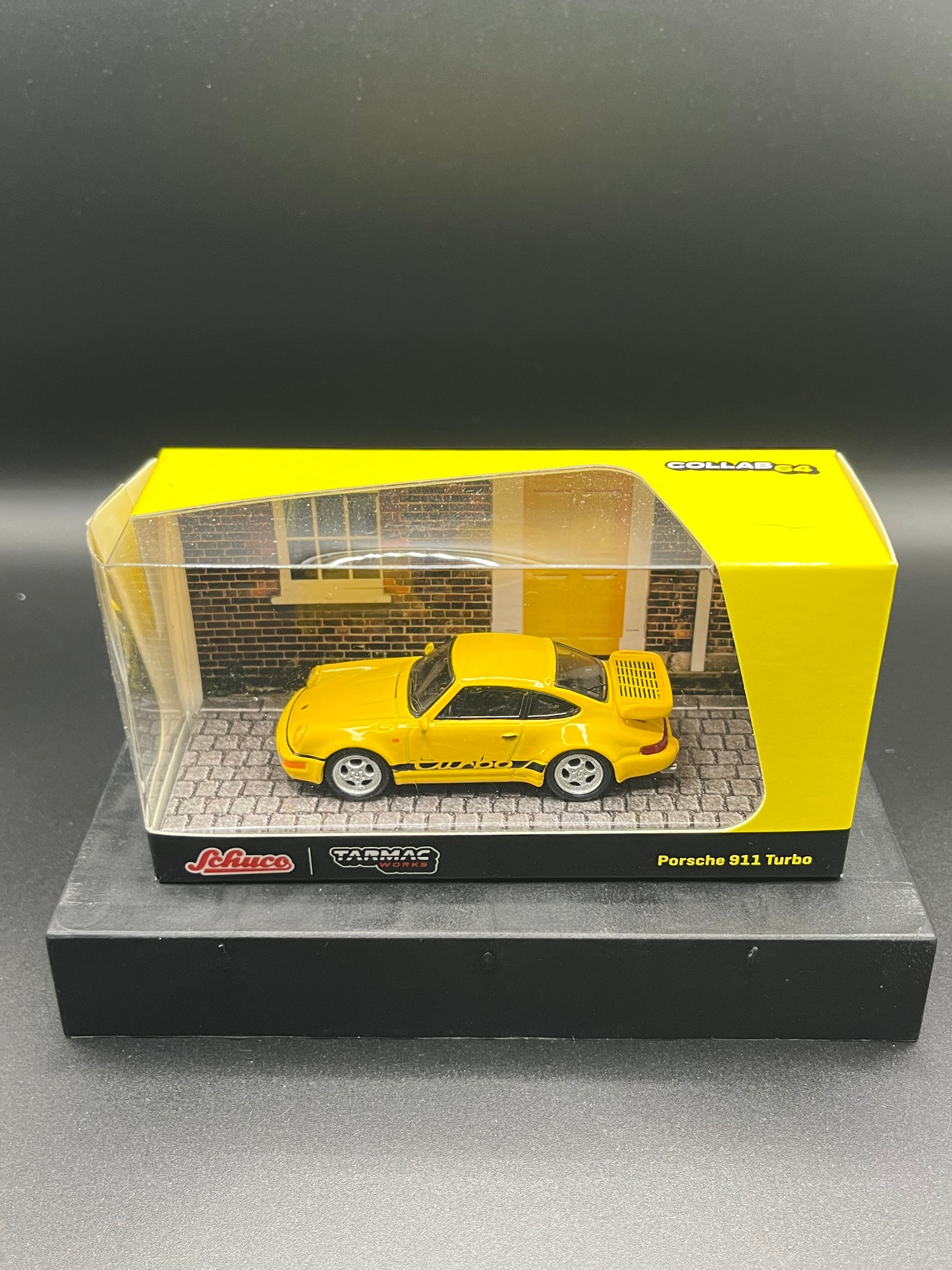 Tarmac Works x Schuco 1:64 Porsche 911 RSR 3.8 (Yellow) – Collab64